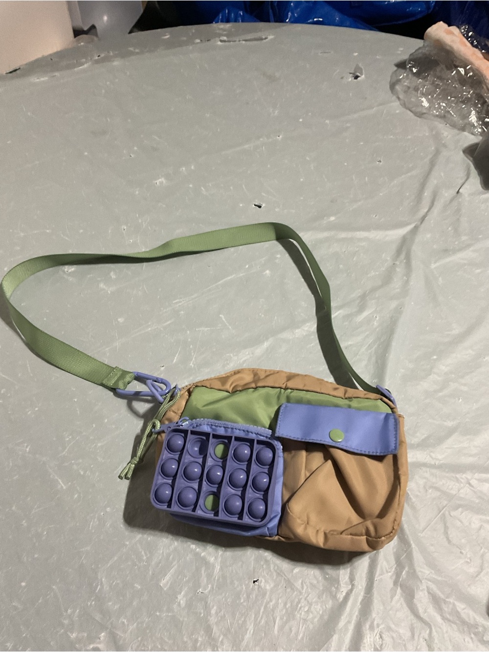 Green & Tan Crossbody Bag with Purple Pop-It Accent